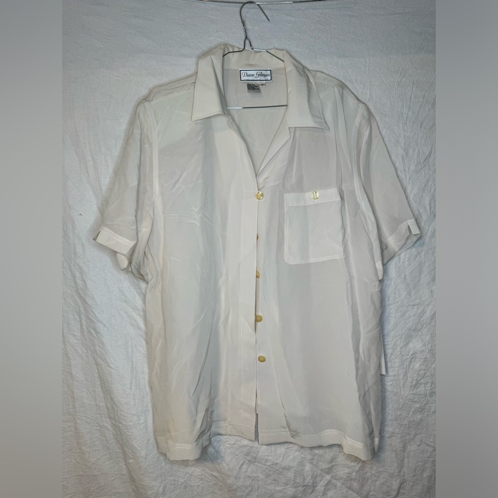 Diane Gilman, white button up top,